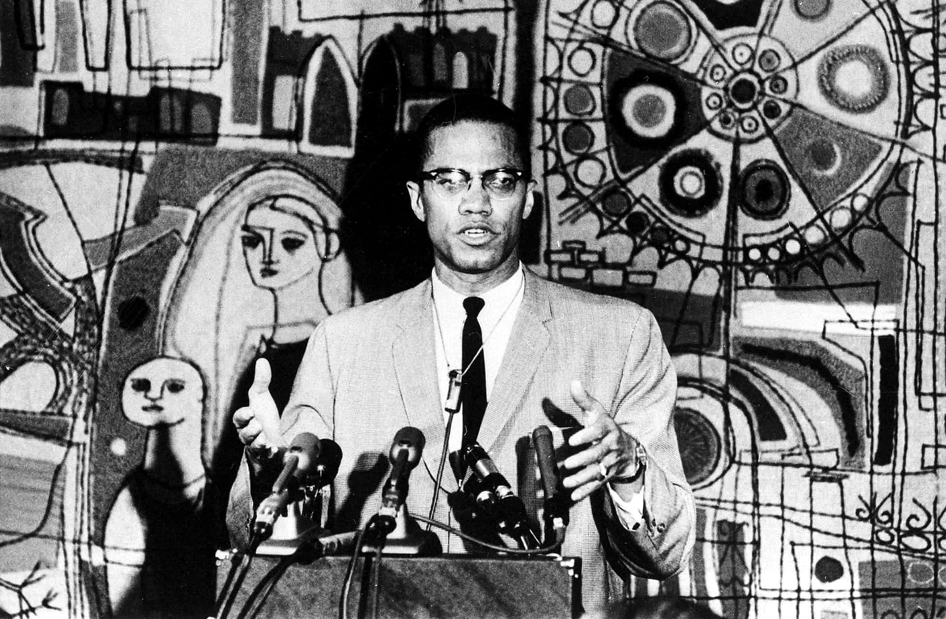 Malcolm X Speakingat Podium Background