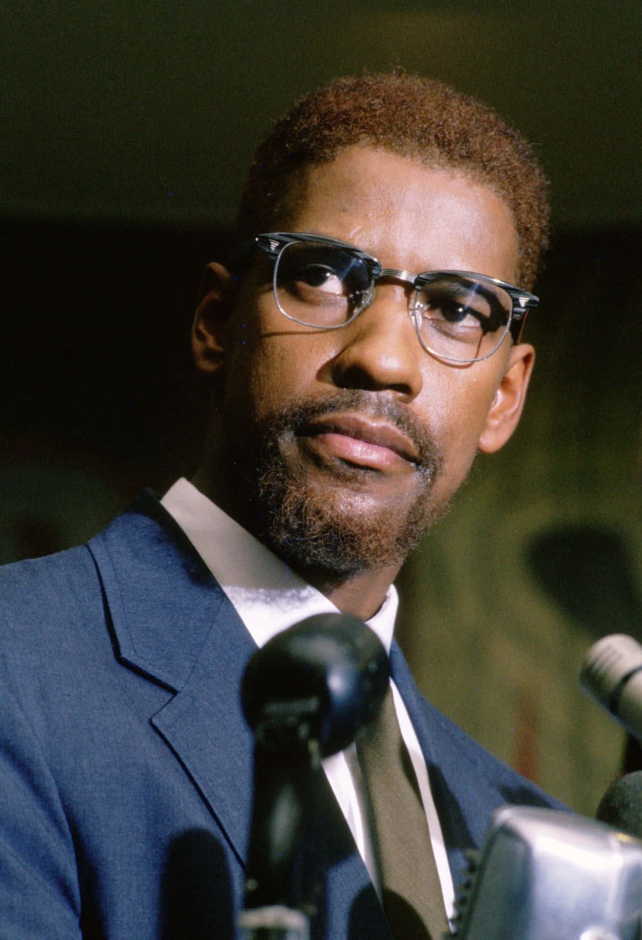 Malcolm X Speakingat Podium Background