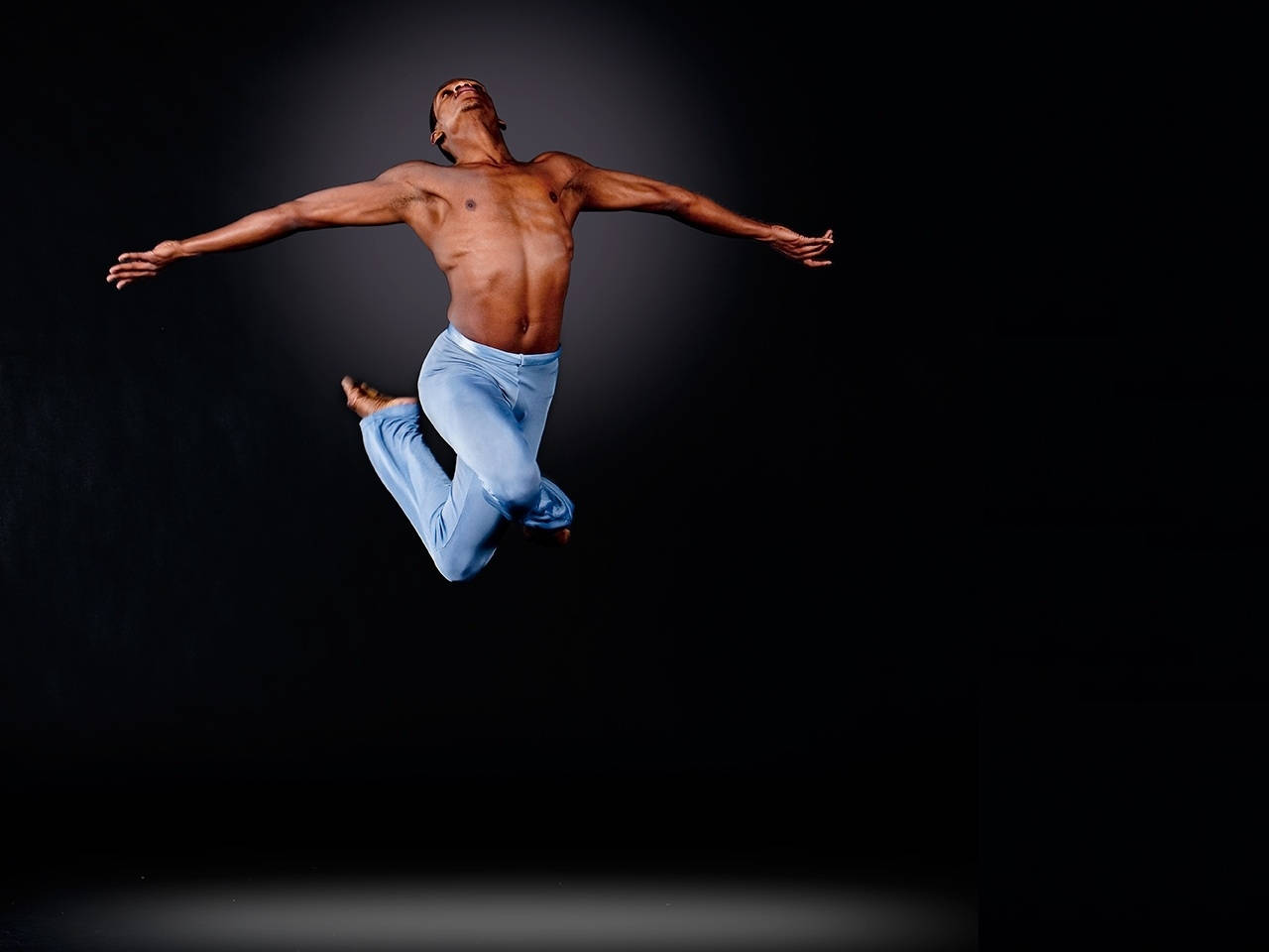 Male Dancer Mid-air Dance Pose Background