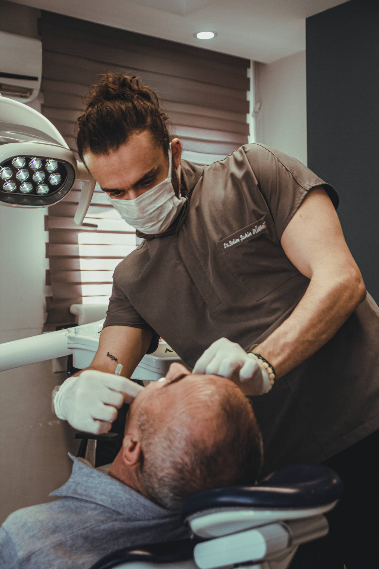 Male Dentist Checking Patient Dentistry Background