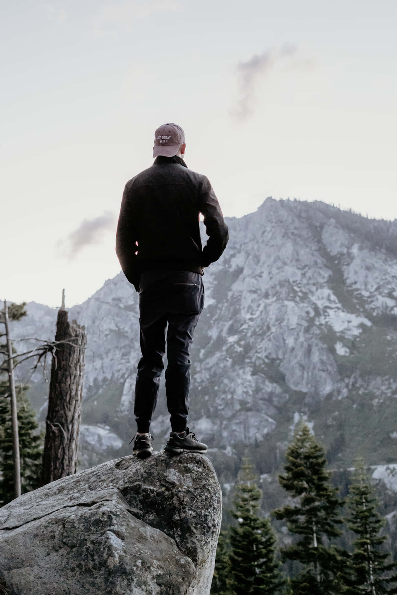 Male Person Standing On Rock Background