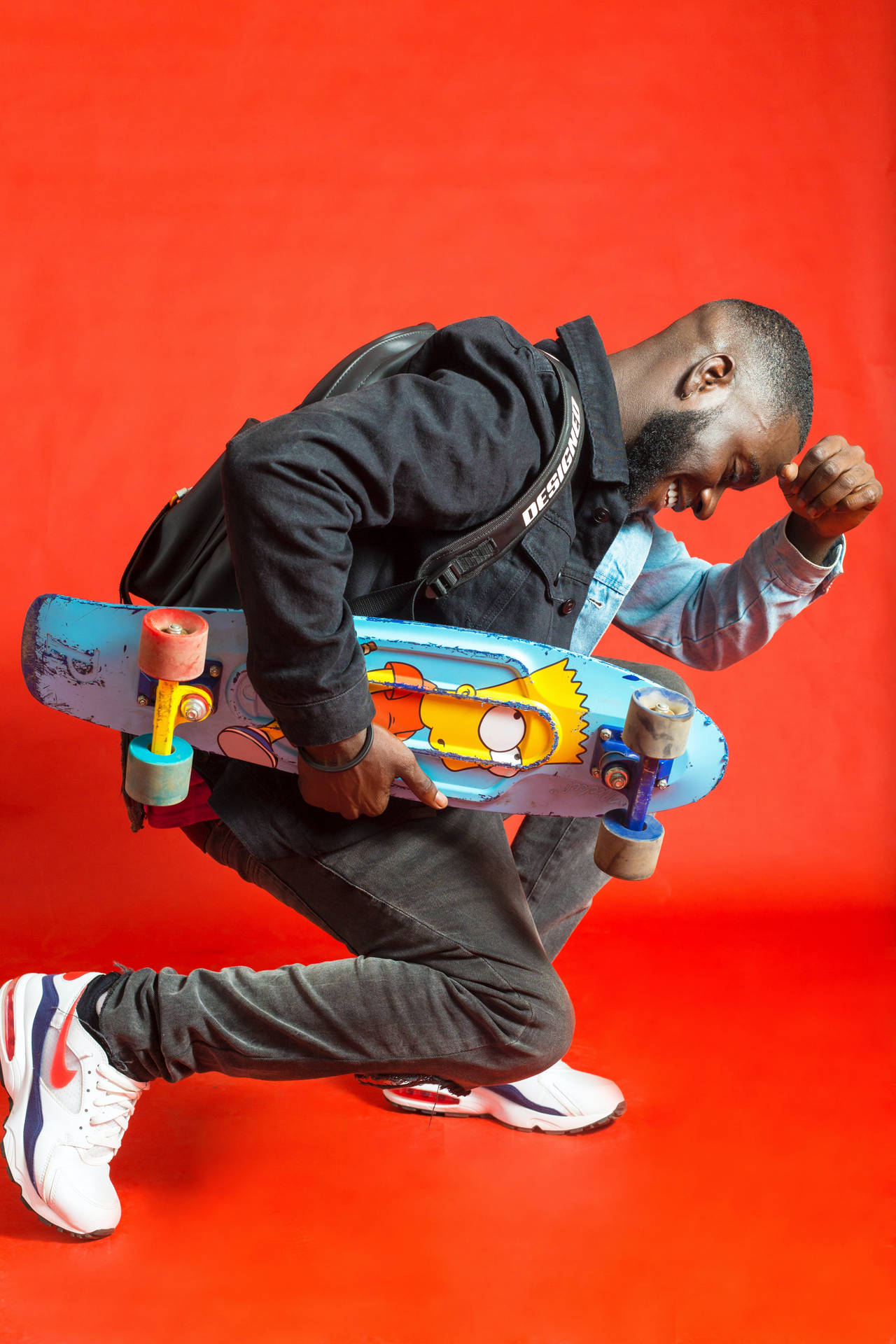 Male Pose With A Skateboard Background