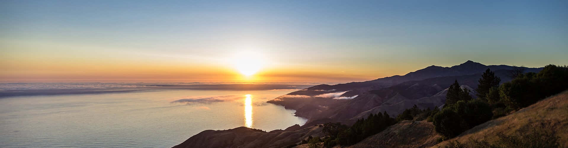 Malibu Beach At Dawn - A Picturesque Sunrise Background