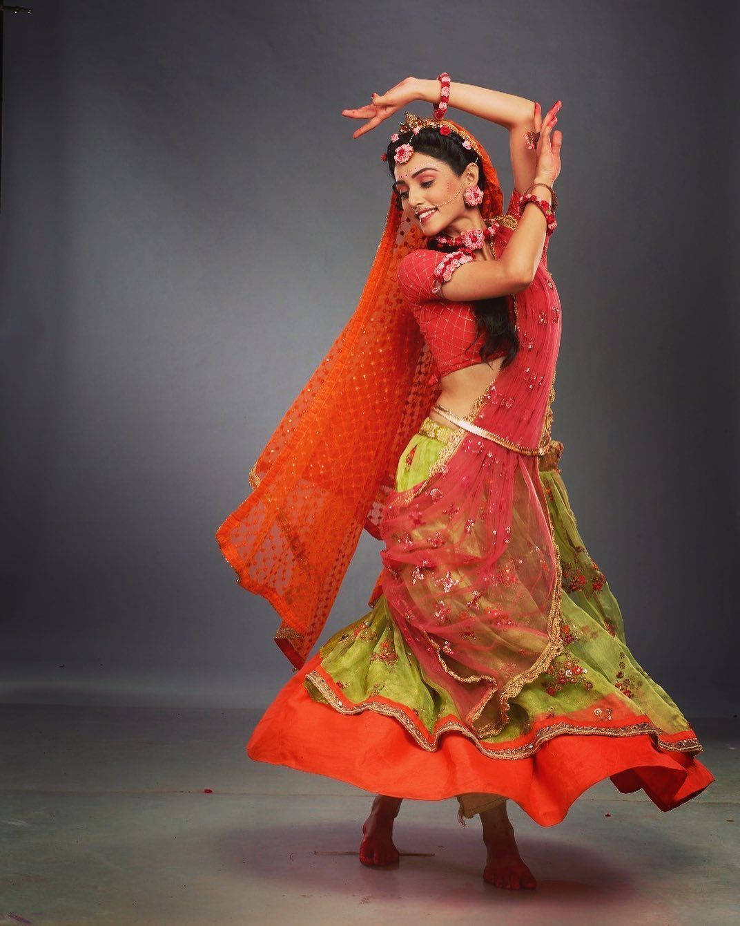 Mallika Singh Red Dress Dancing Background