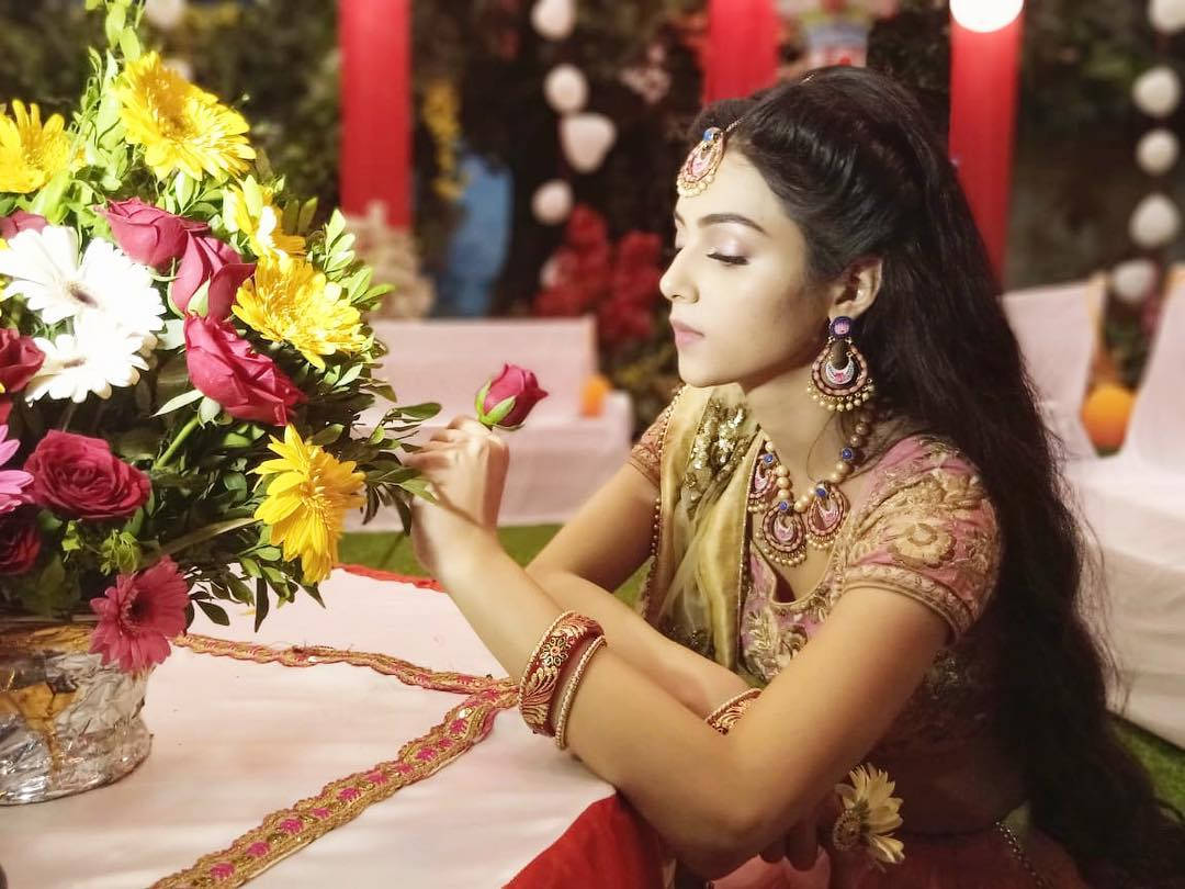 Mallika Singh Smelling Rose Background