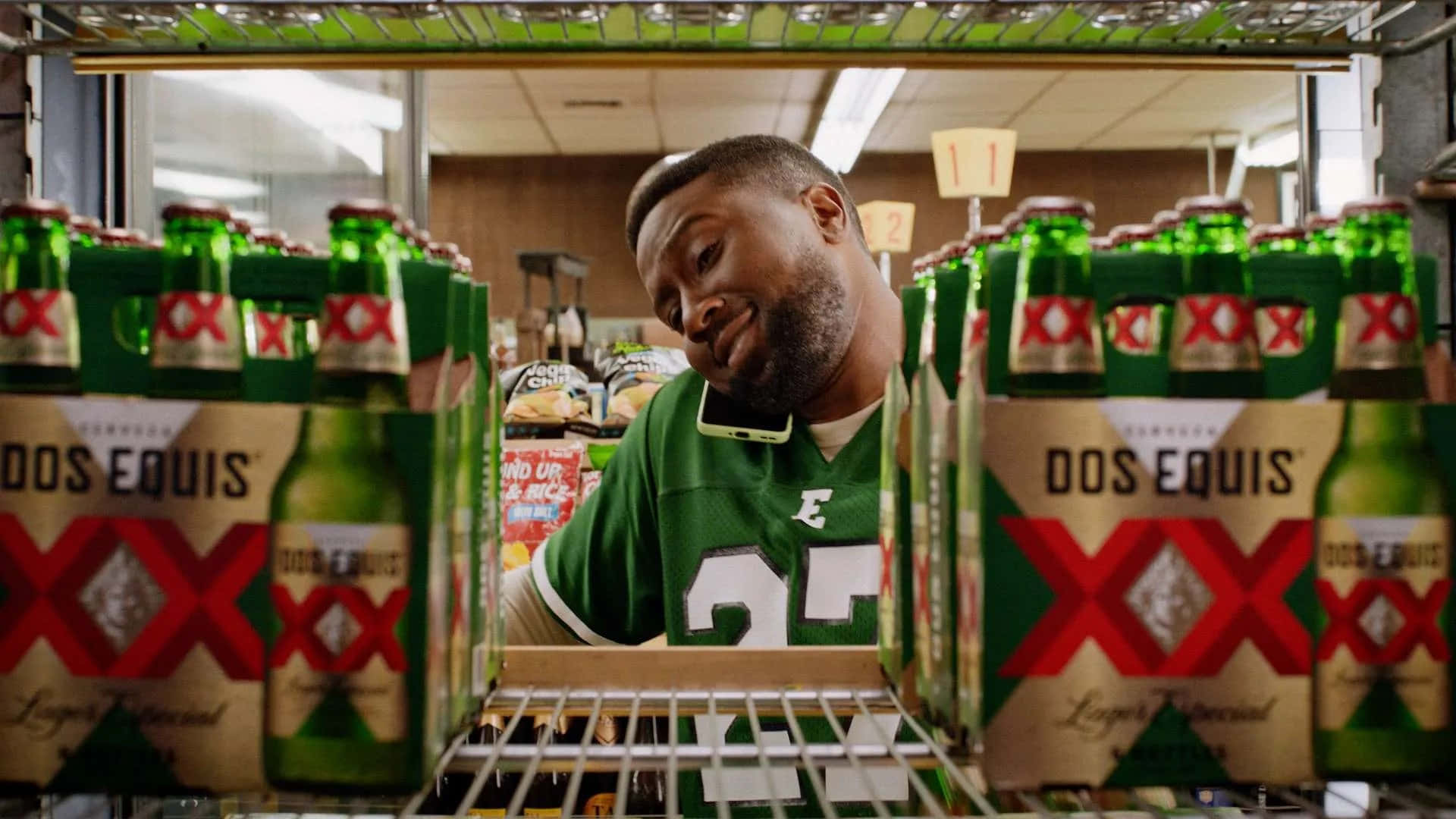 Man Admiring Dos Equis Beer Background
