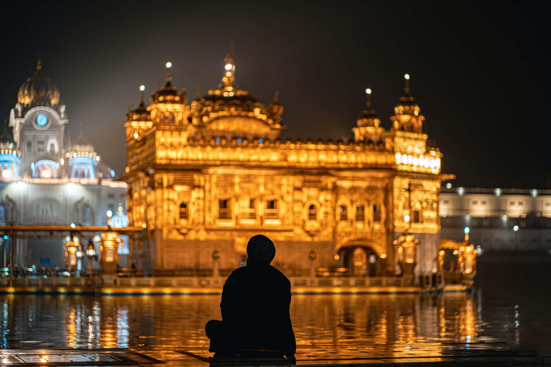 Man And Golden Temple Background