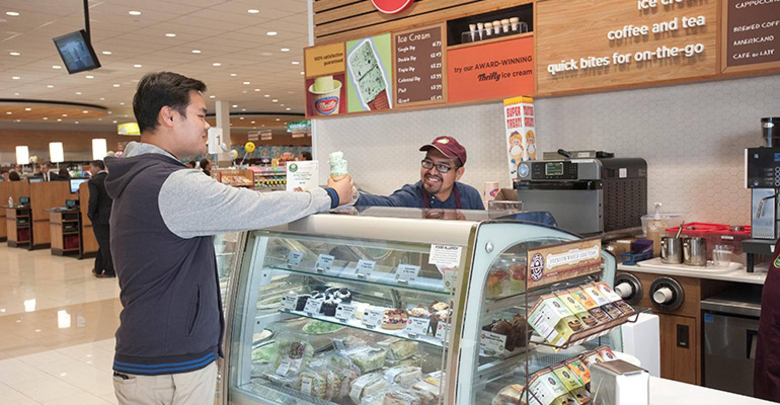 Man Buying Ice Cream From Thrifty Background