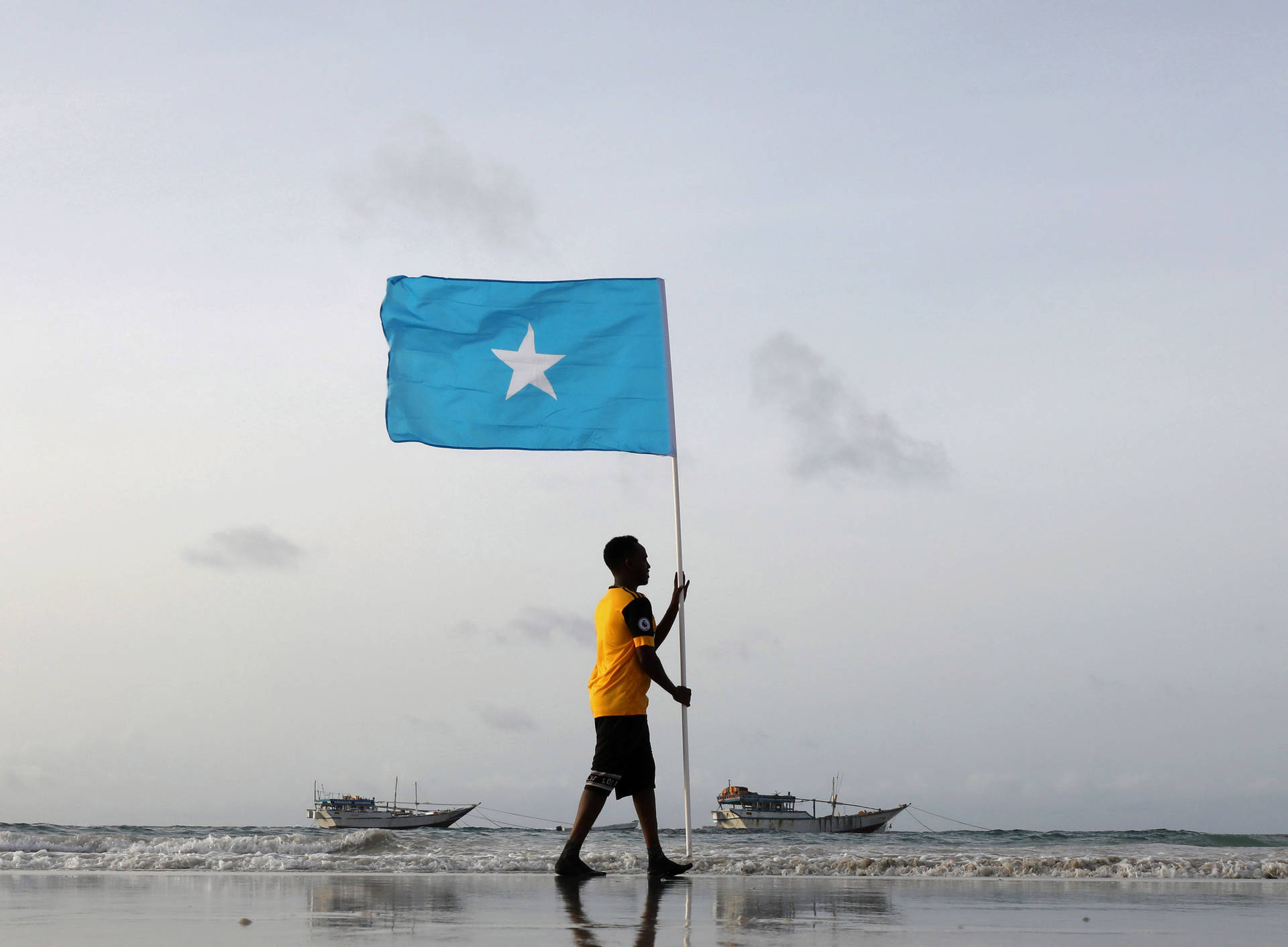 Man Carrying Somalia's Flag Background