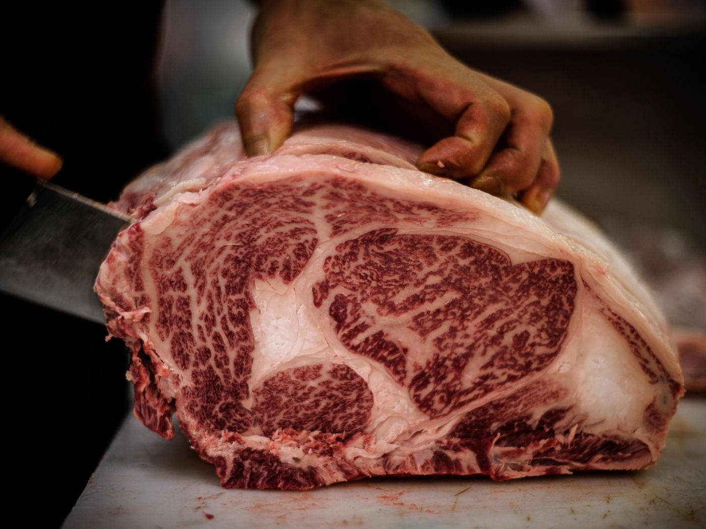 Man Cutting A Kobe Beef