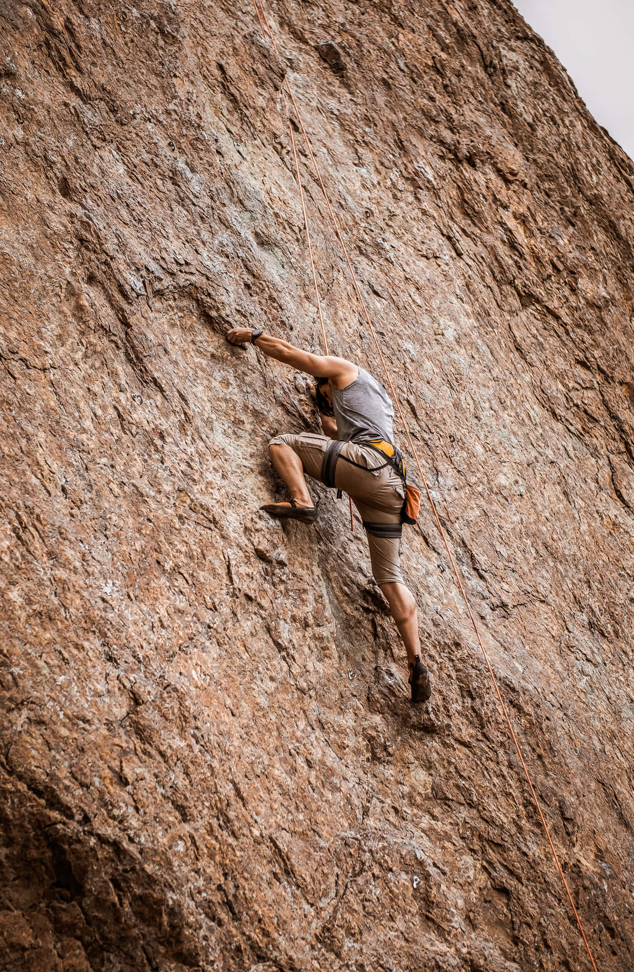 Man Doing Arduous Free Climbing Background