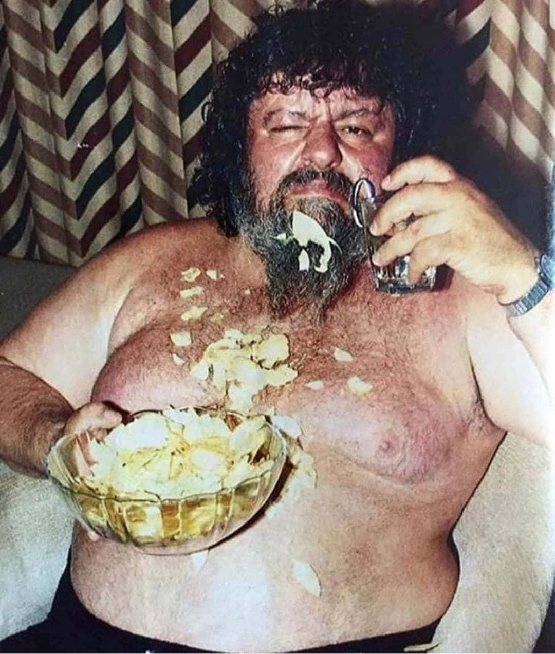 Man Eating Chipsand Drinking Background