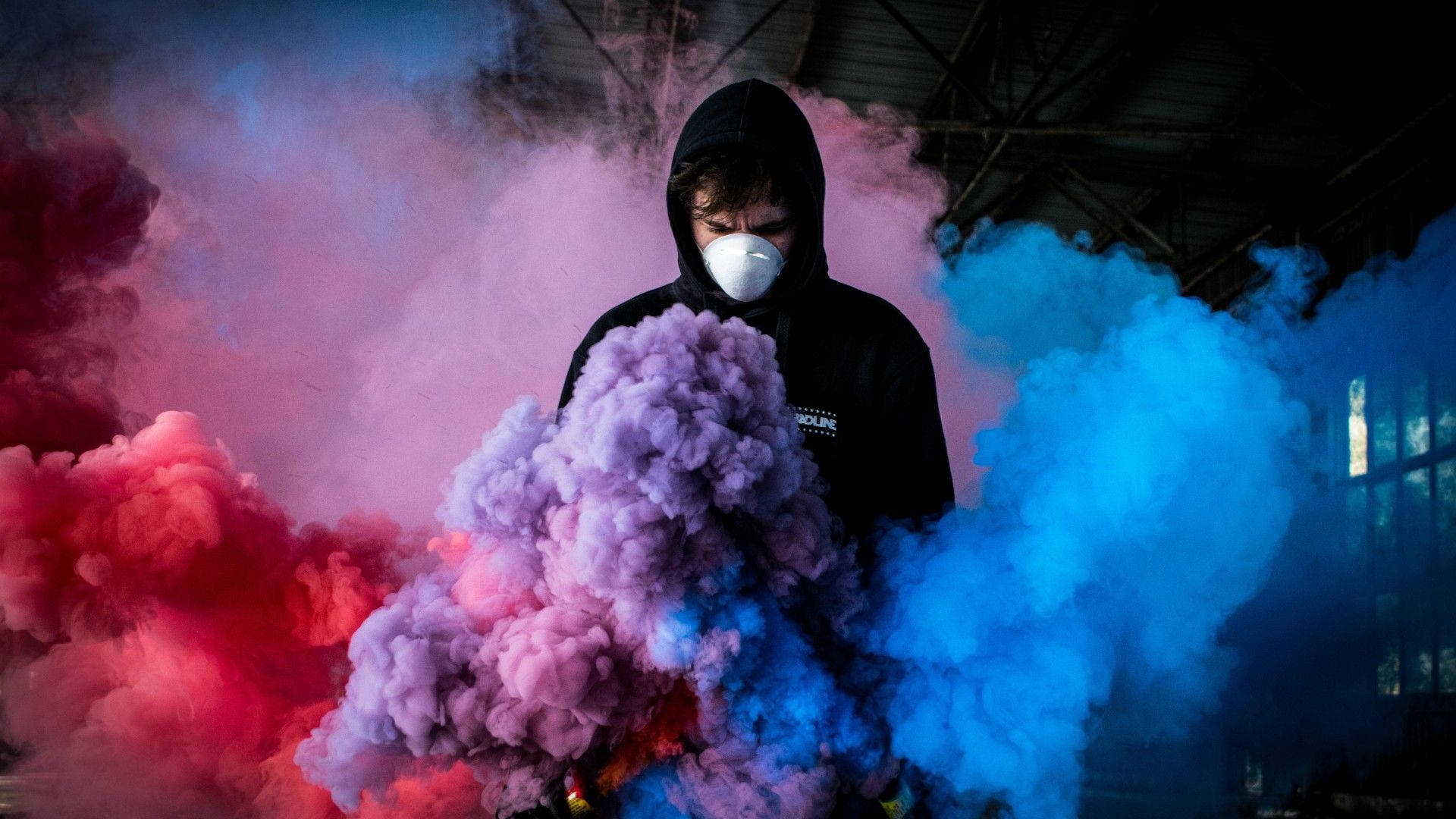 Man Engulfed With Colorful Gas Smoke