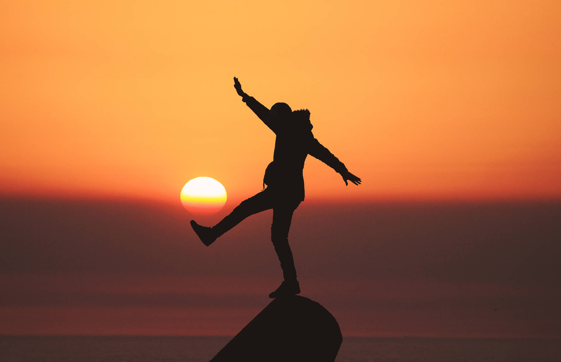 Man Enjoying Life During Sunset Background