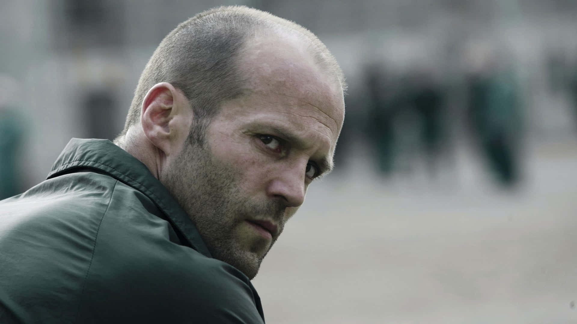 Man Face British Actor Jason Statham Background