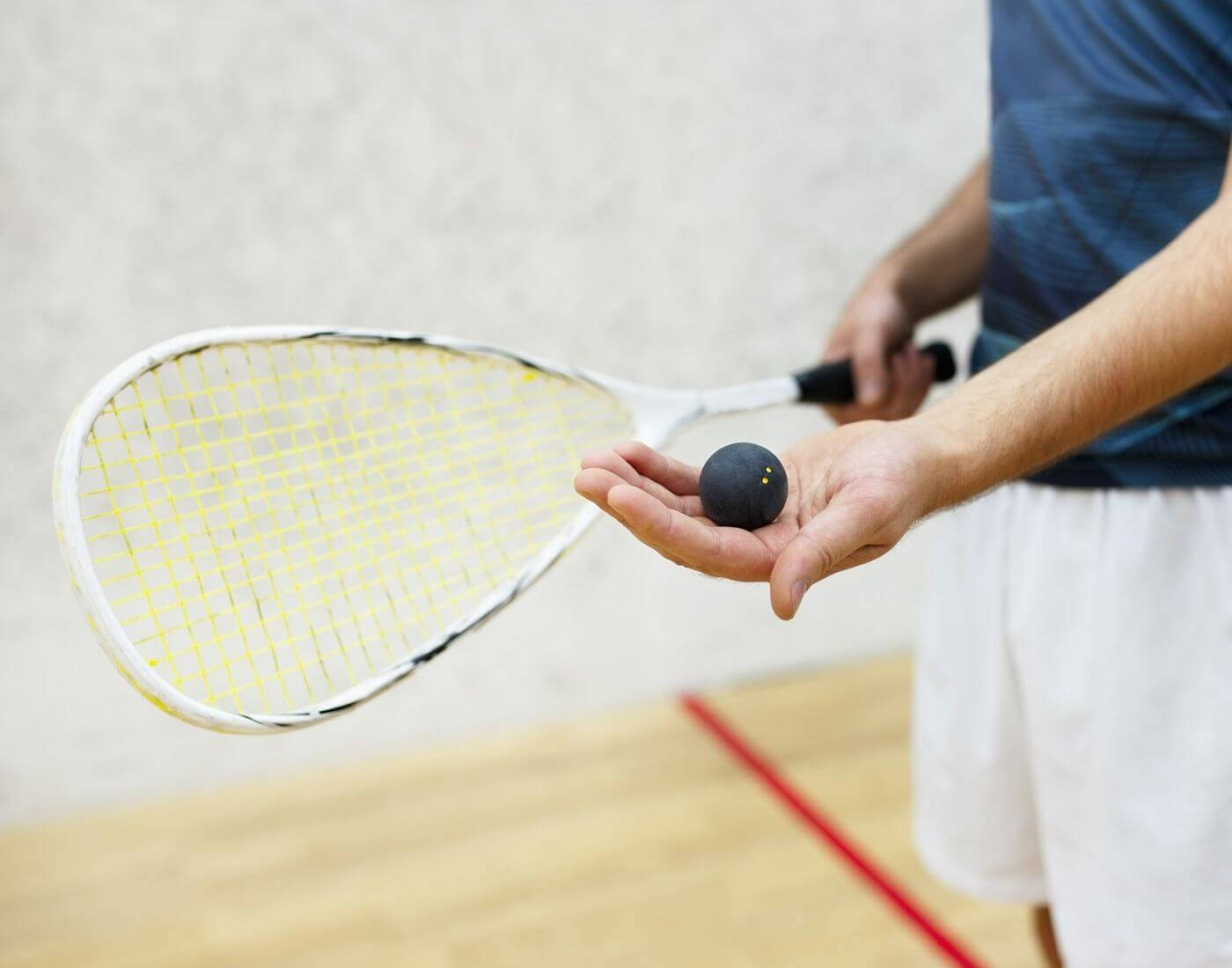 Man Getting Ready For Racquetball Match Background