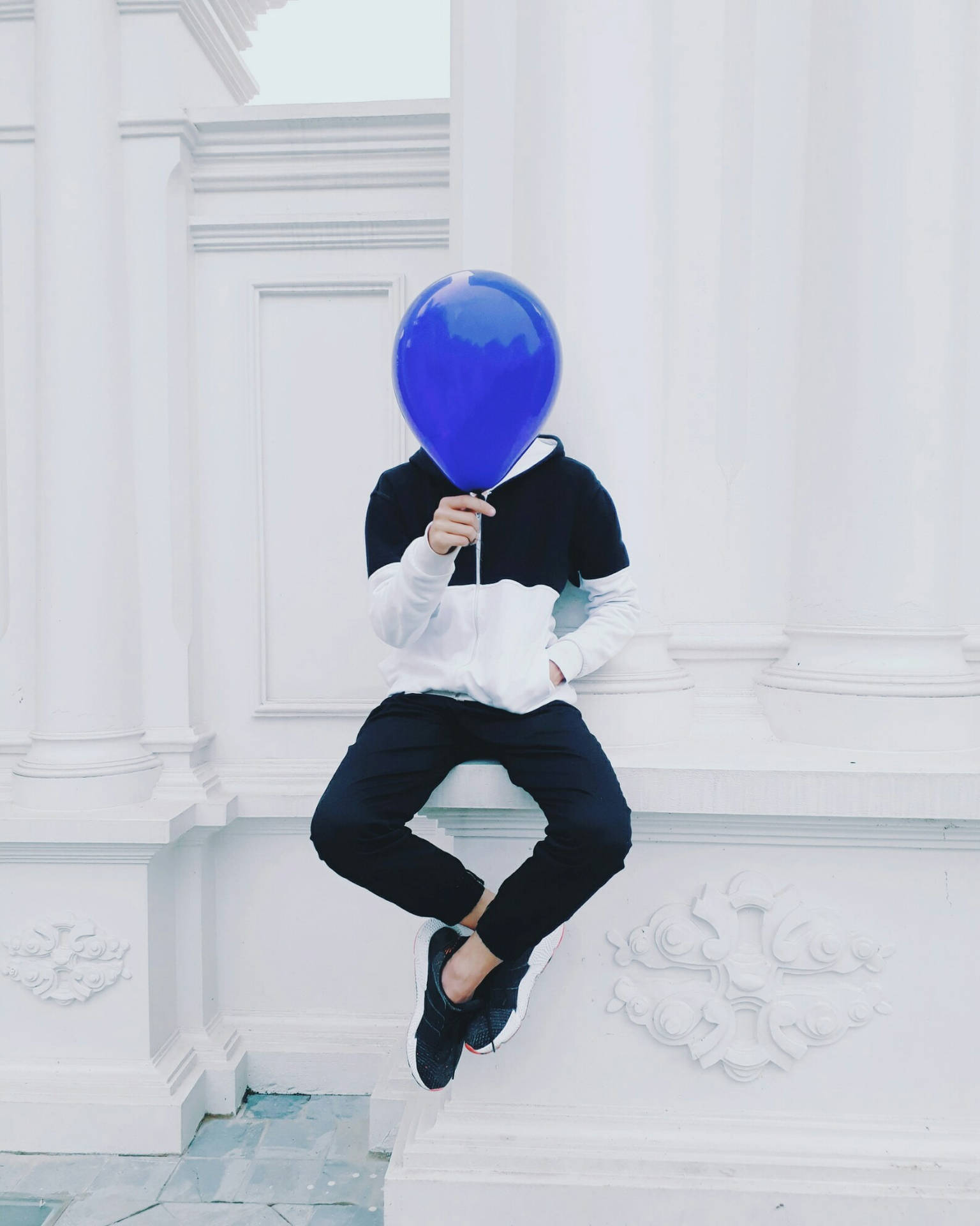 Man Holding Blue Balloon Background