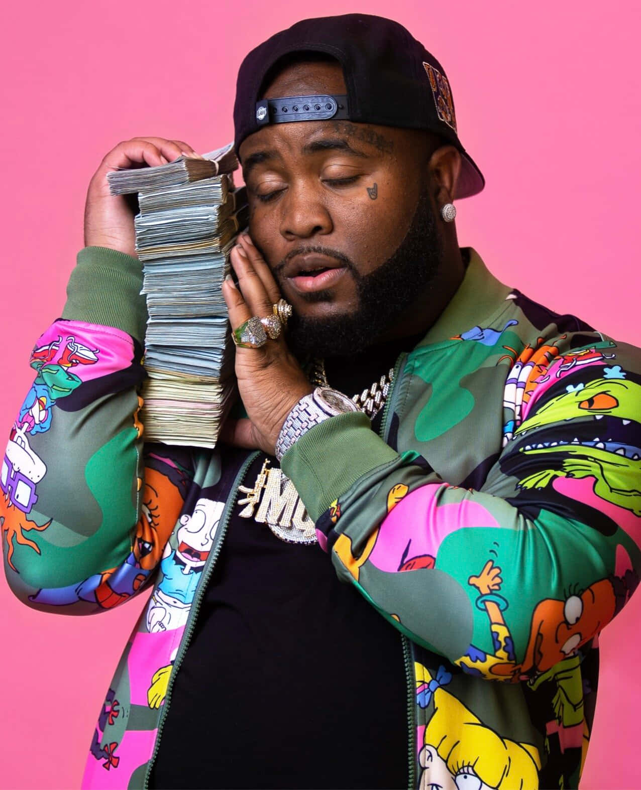Man Holding Money Stacks Against Pink Background Background