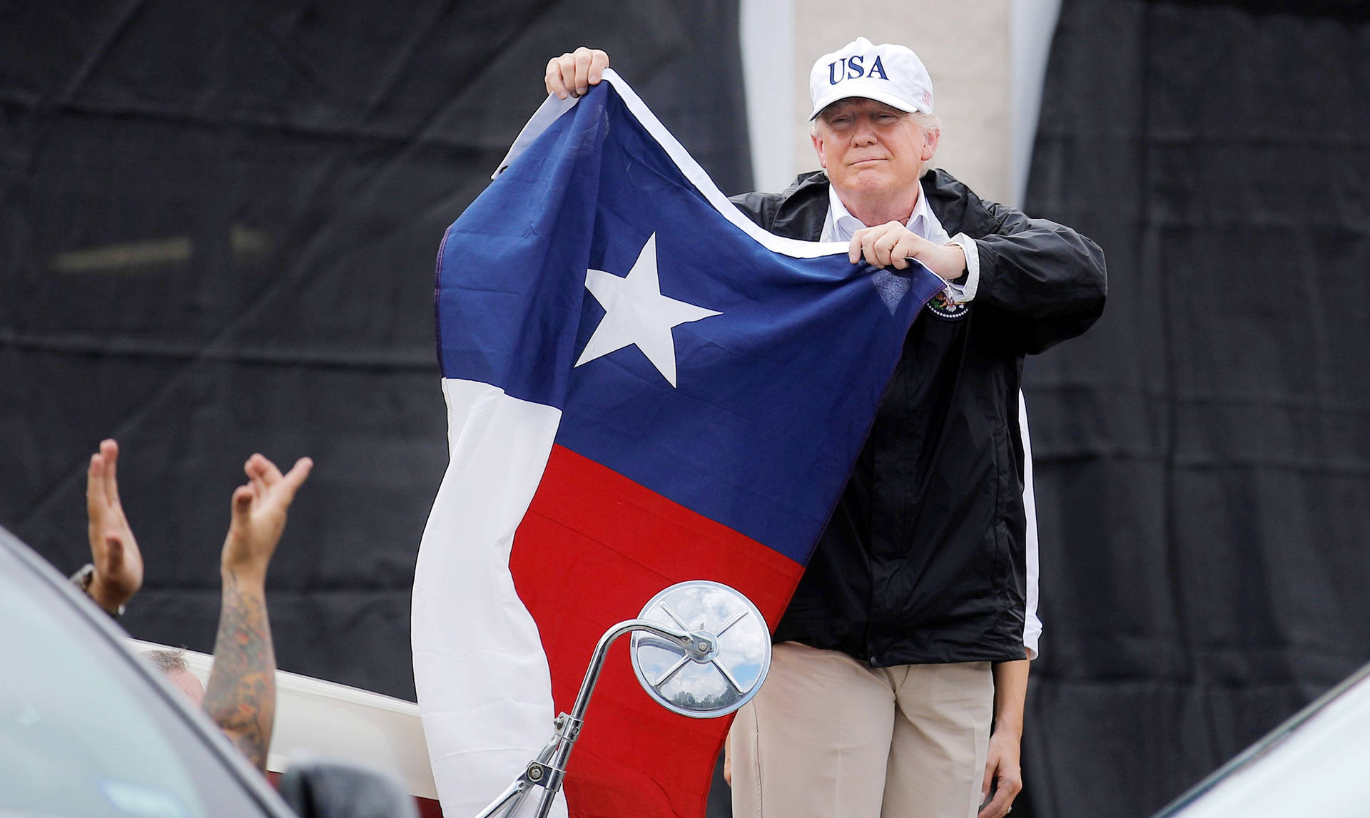 Man Holding Texas Flag Background