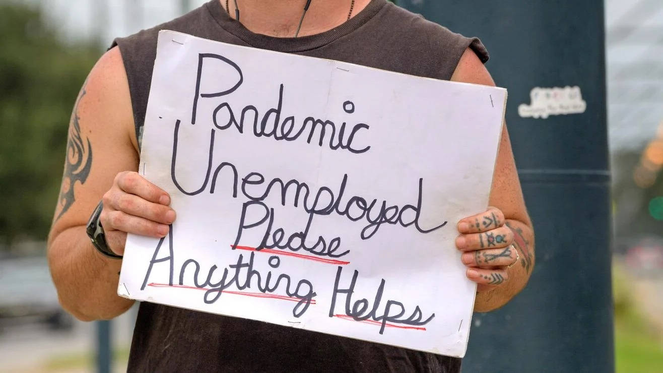 Man Holding Unemployment Signboard During Pandemic