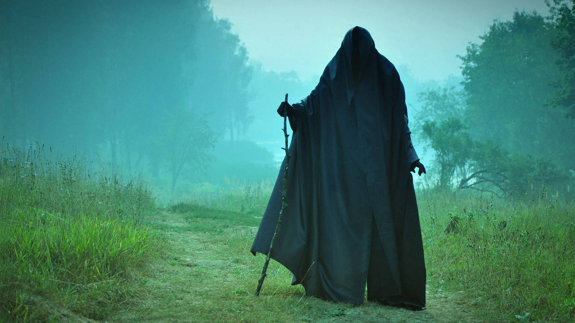 Man In Black Cloak Scary Background