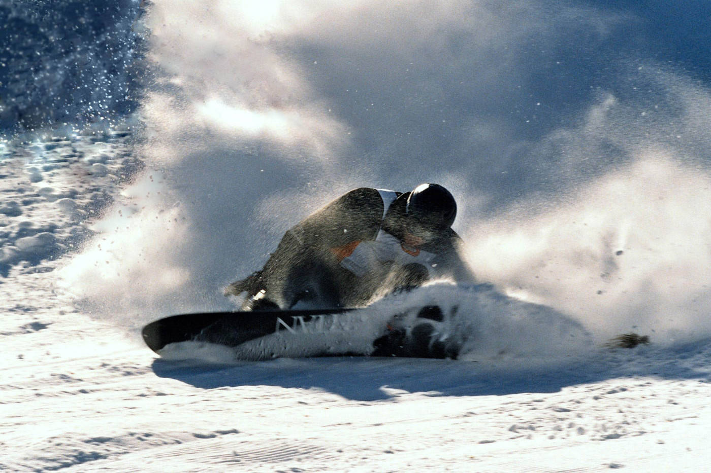 Man In Black With A Snowboard Background