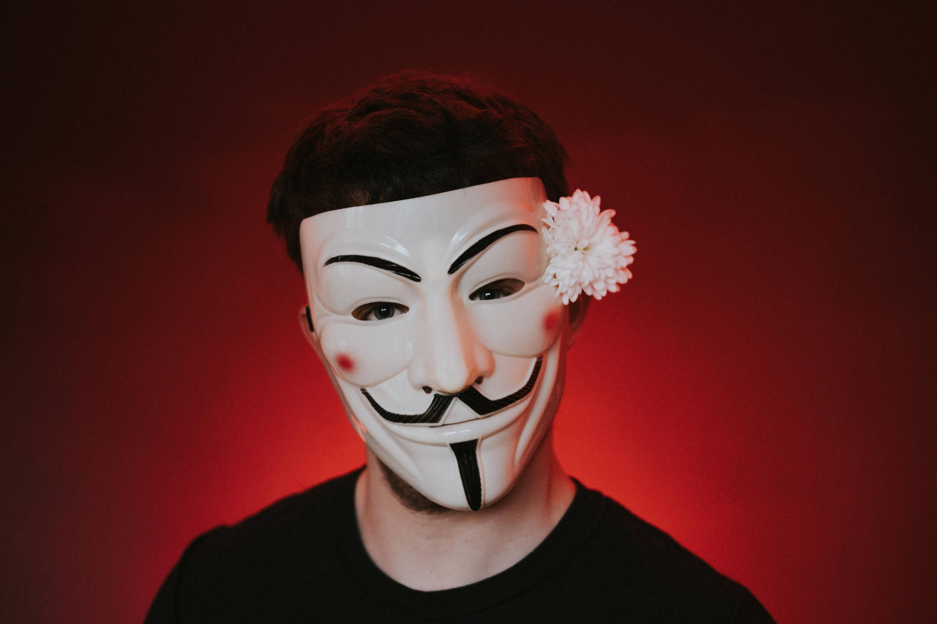 Man In Hacker Mask With Flower Background