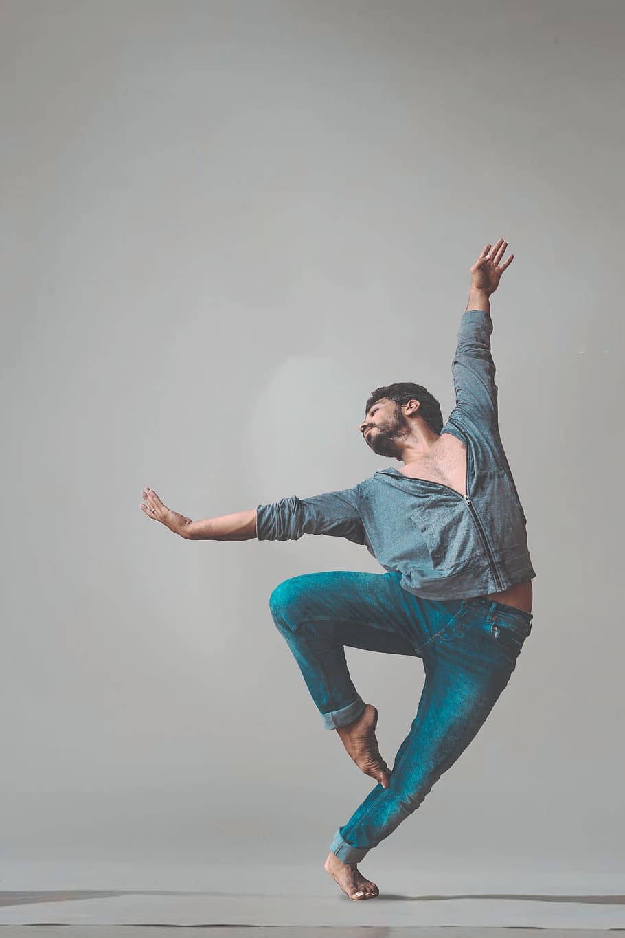 Man In Jeans Dance Pose Background