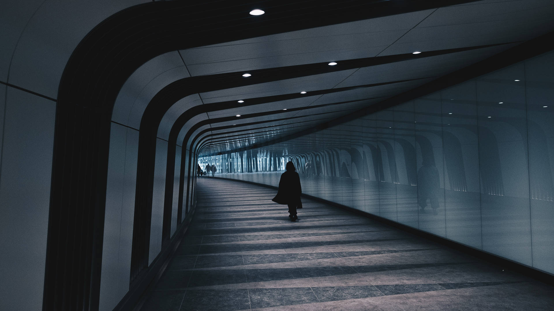 Man In Massive Underground Tunnel Background