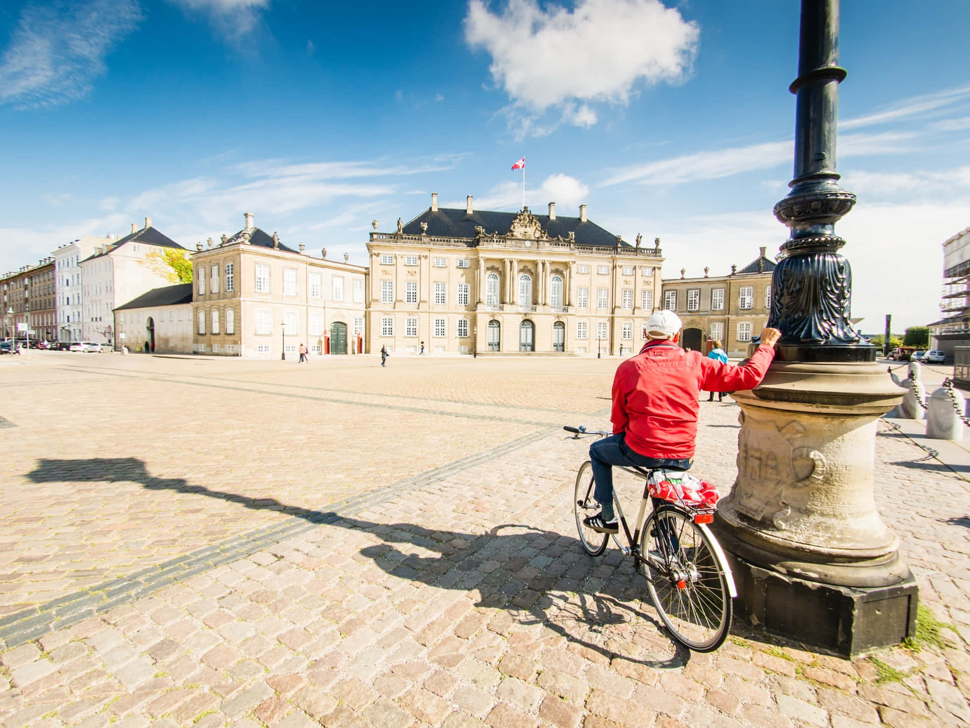 Man In Red In Amalienborg Palace Background