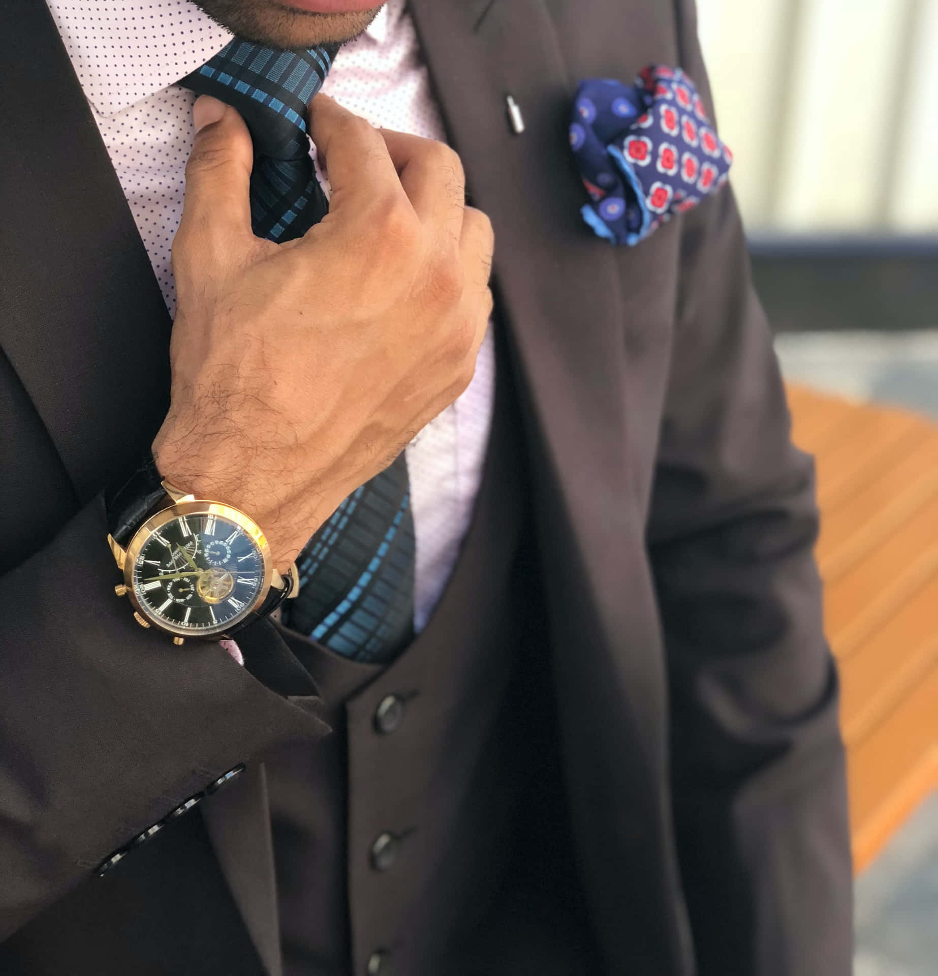 Man In Suit Fixing His Necktie Background