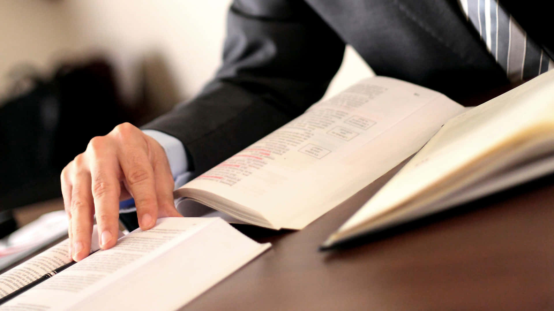 Man In Suit Reading Contract Books Background