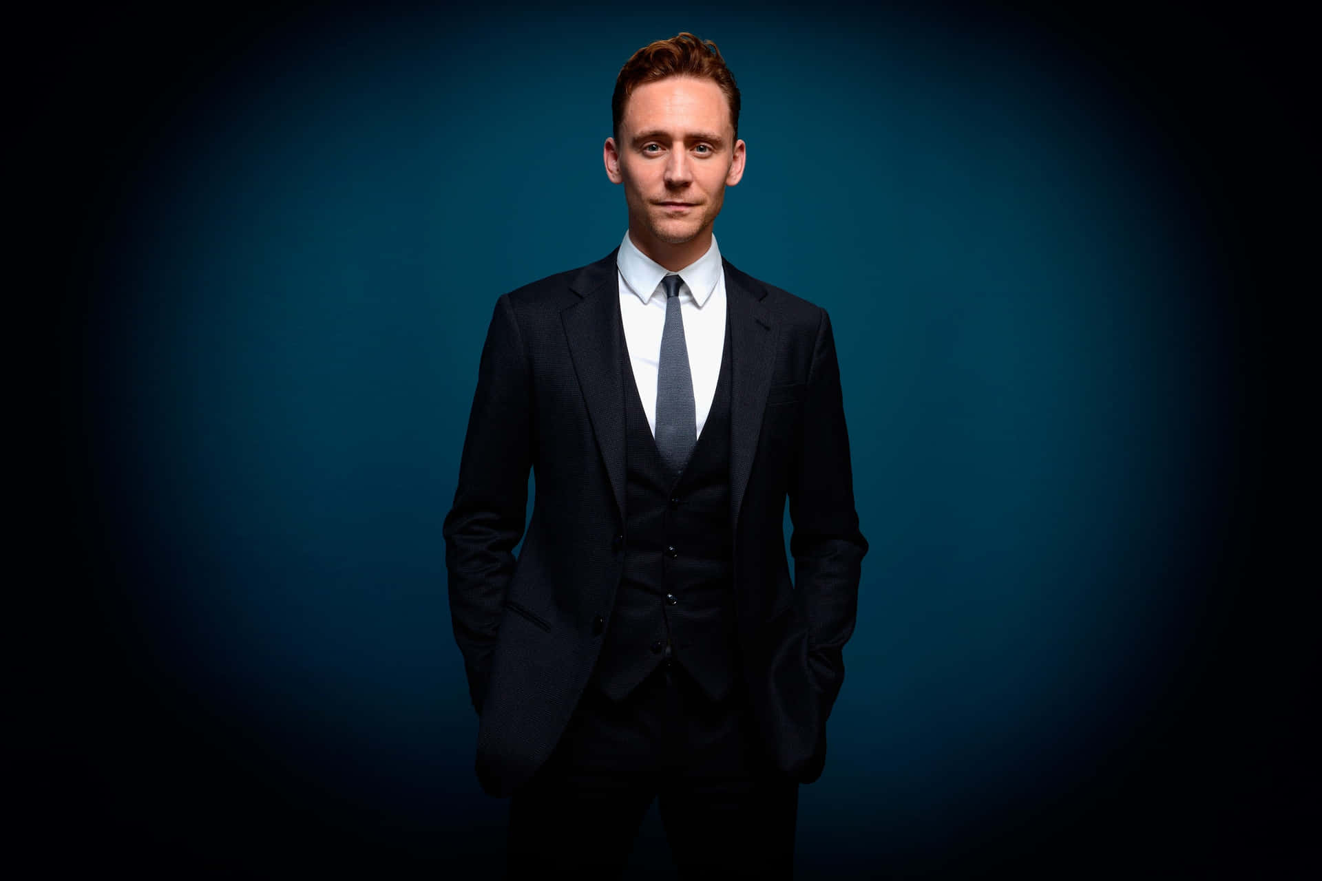 Man In Suit Tom Hiddleston Background