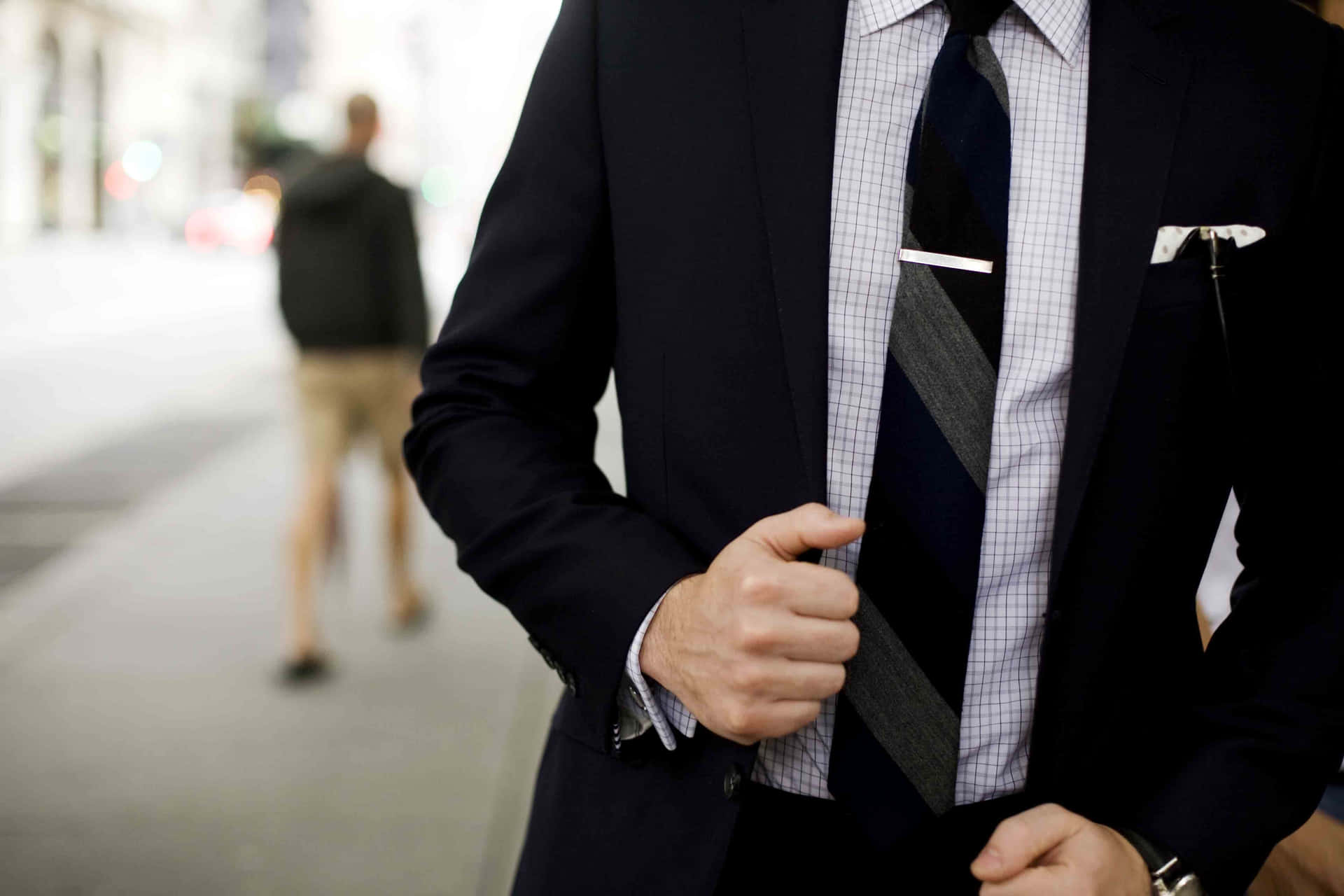 Man In Suit Touching His Coat Background