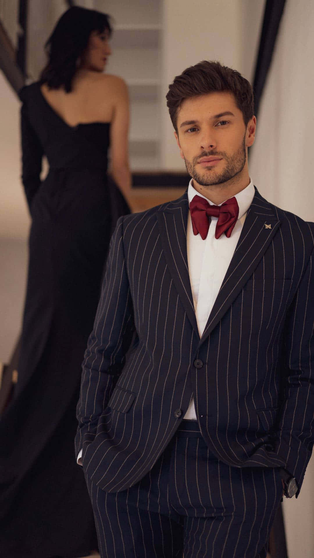 Man In Suit With Red Bowtie Background