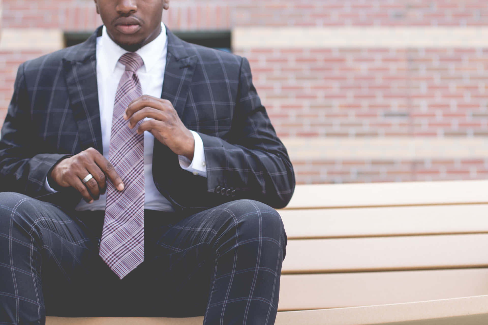 Man In Suit With Striped Necktie Background