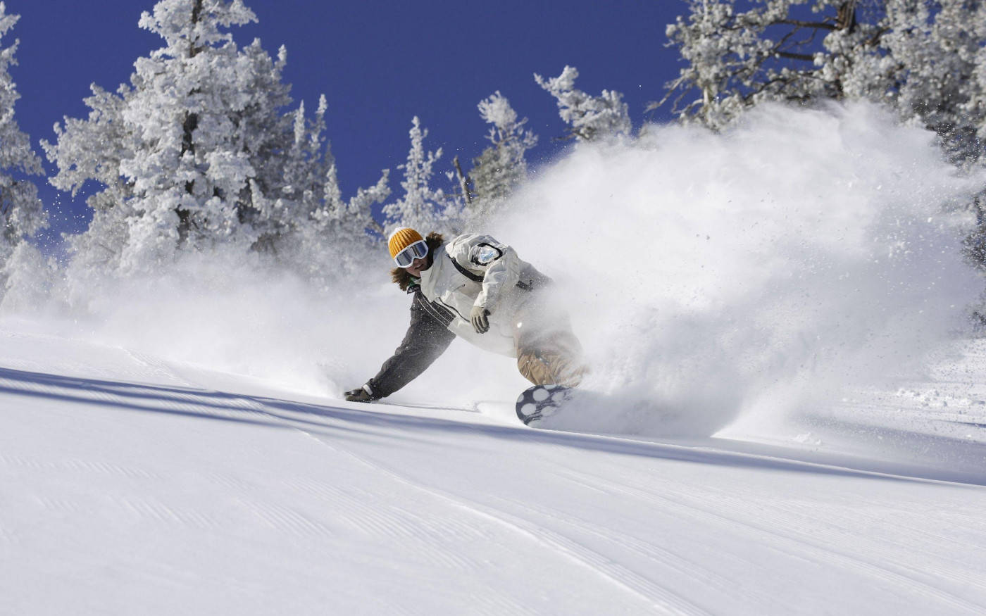 Man In White Descending With Snowboard