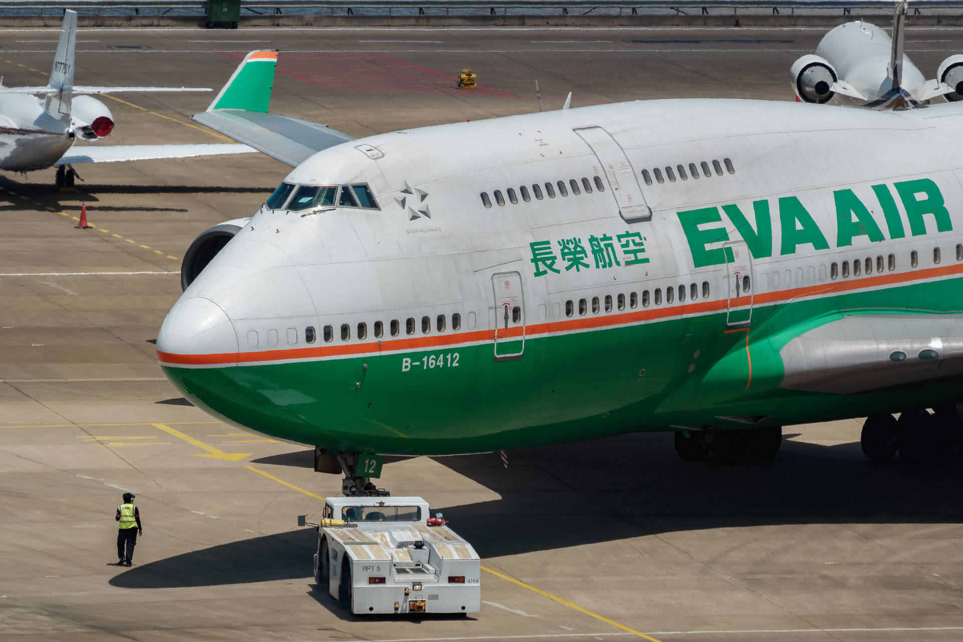 Man Infront Of Eva Air Background