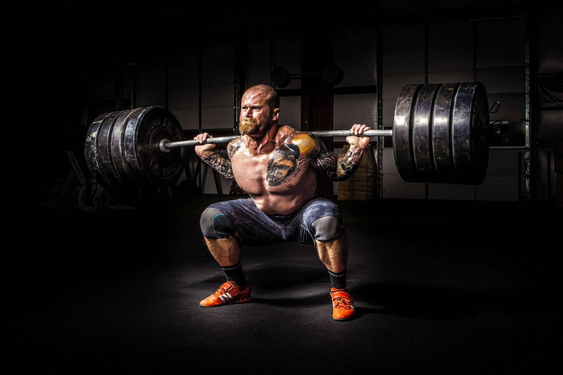 Man Lifting 4 Plates Barbell Background