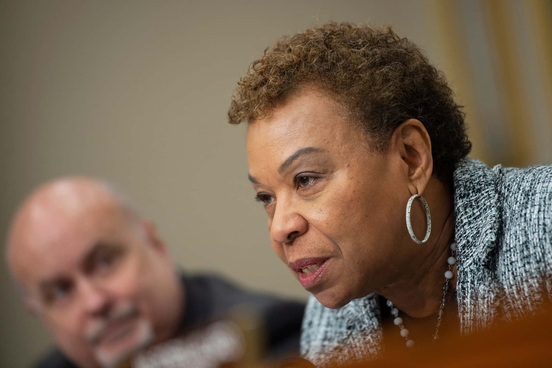 Man Looking At Barbara Lee Background