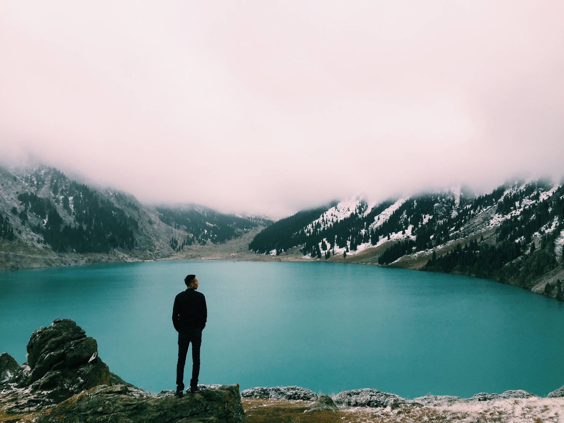 Man Looking At Big Almaty Lake Background