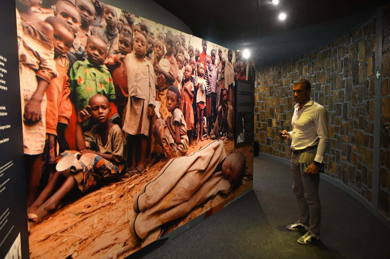 Man Looking At Kigali Genocide Memorial Pictures