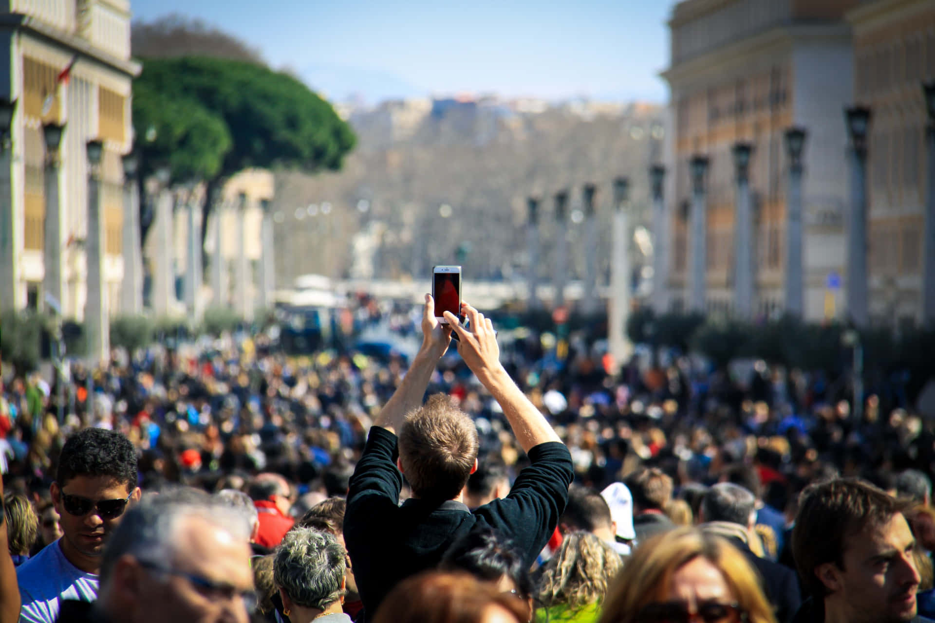 Man Looking Conspicuous With His Arms Raised For A Photo
