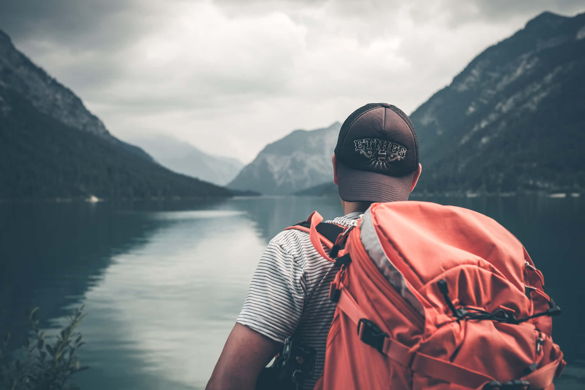 Man On A World Travel Exploring Lake Background