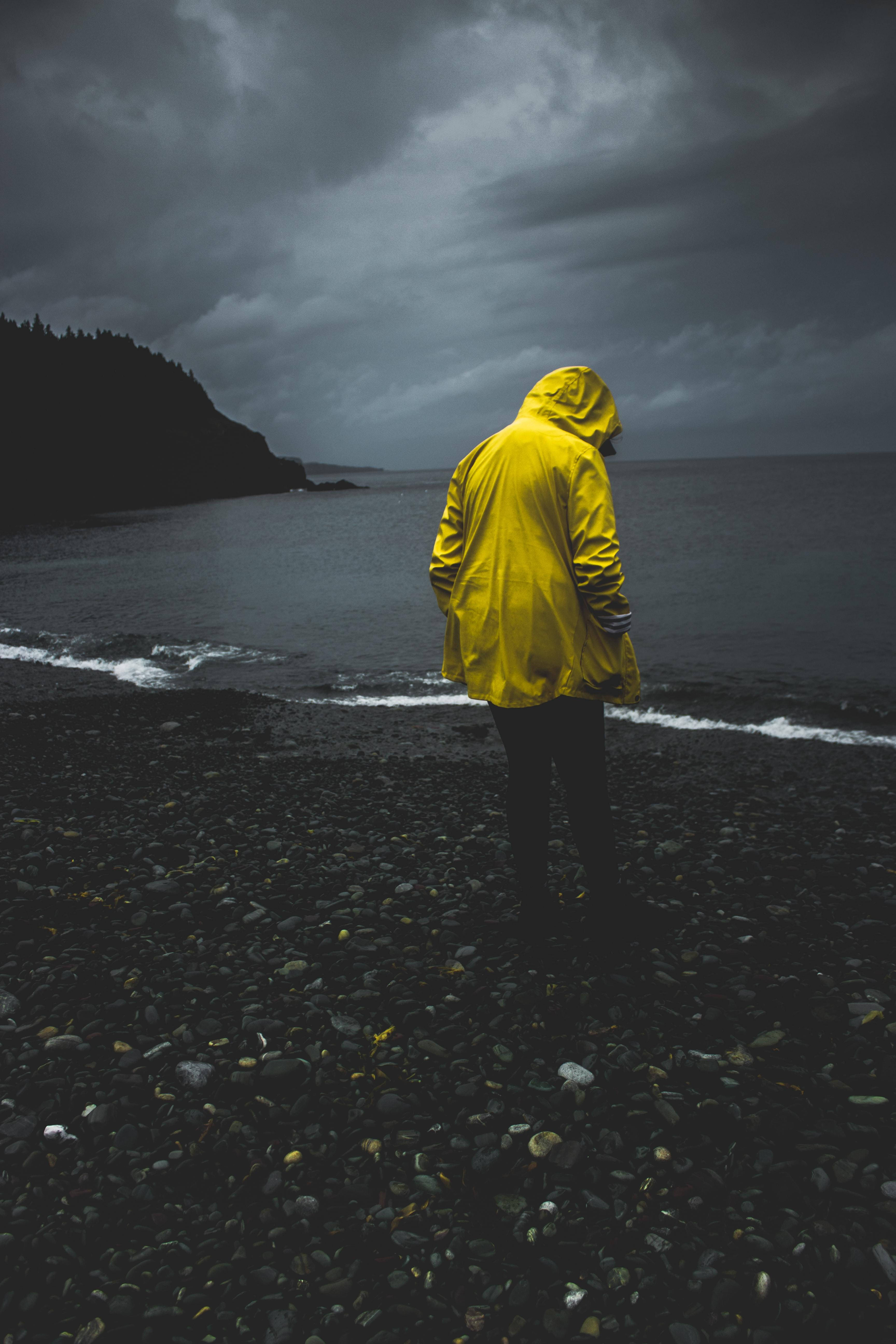 Man On Rocky Seashore Alone Phone