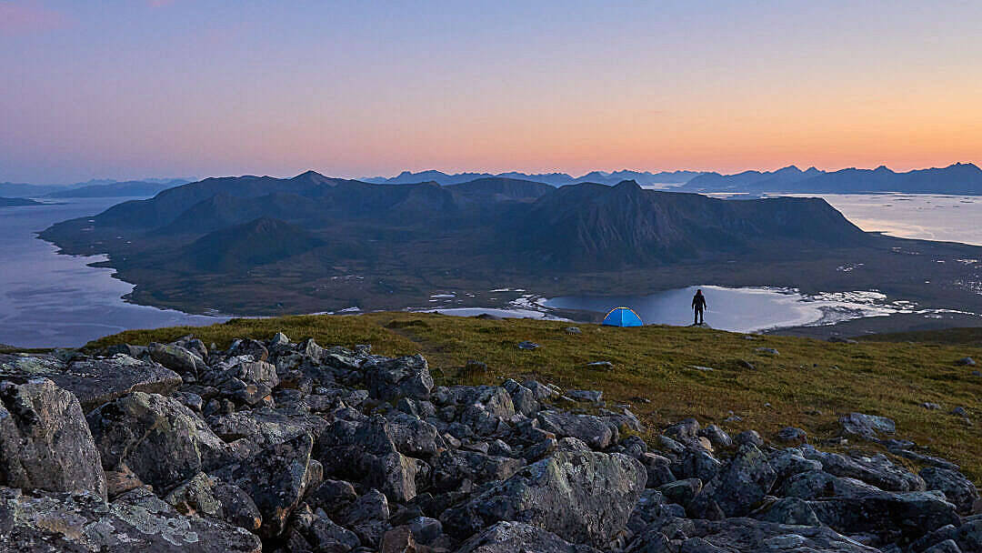 Man Overlooking Hd Mountain Fjord Background