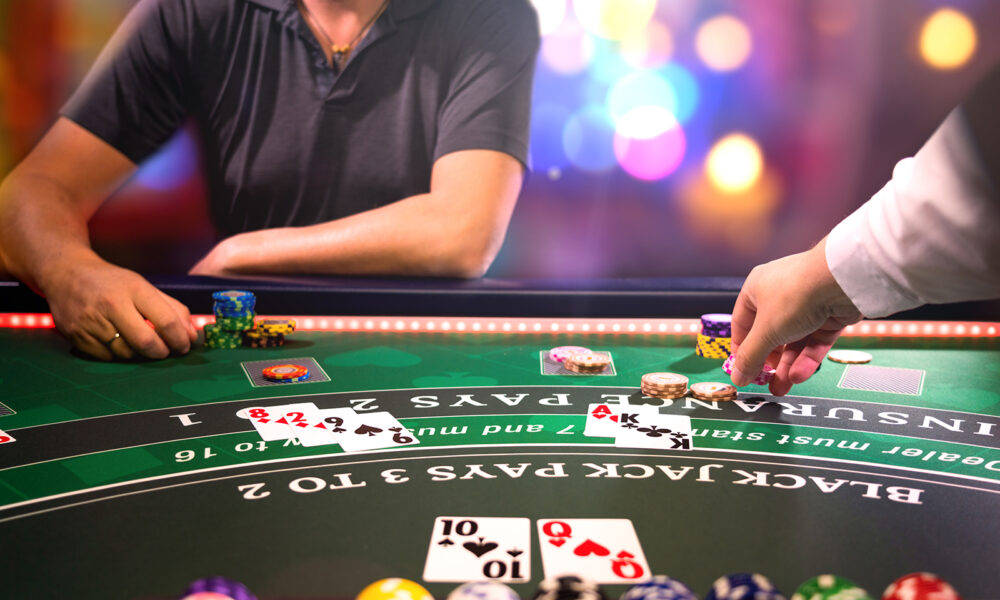 Man Playing Blackjack With Dealer Background