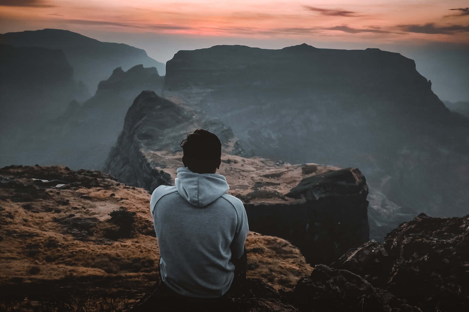 Man Resting After Arduous Trek Background