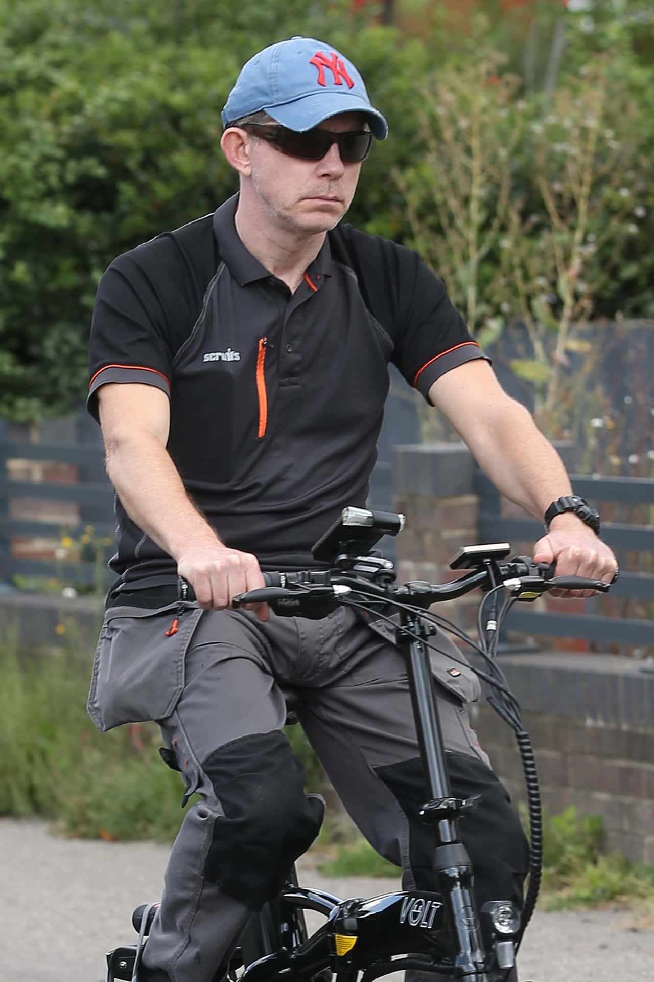 Man Riding Electric Bike Outdoors Background