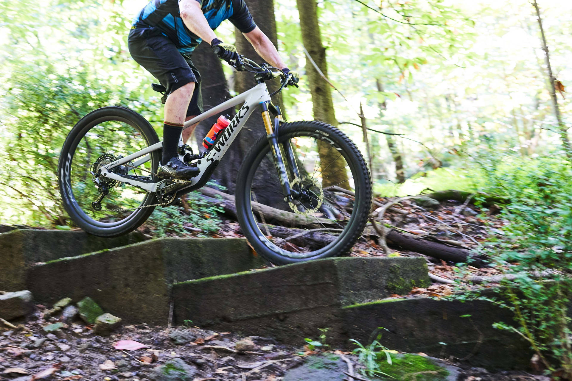 Man Riding Specialized Bike Background